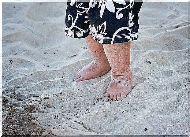 barefoot boy in the sand