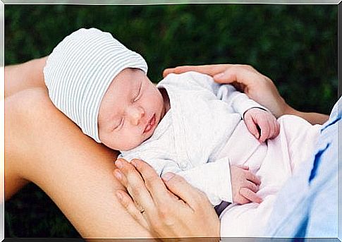 baby on mother's legs