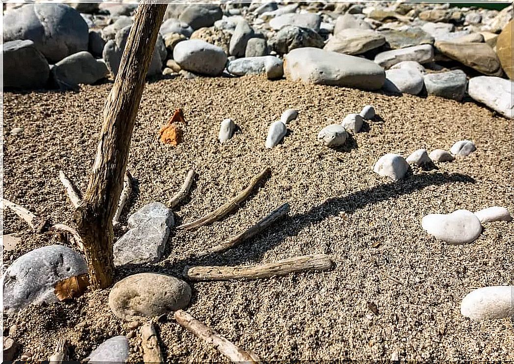 Homemade sundial on the beach.