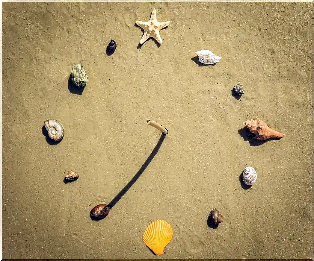 Homemade sundial on the sand.